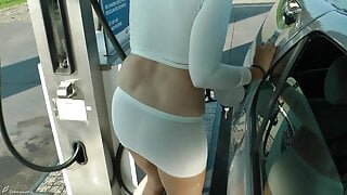 Refuel at the gas station in a mini skirt and no bra